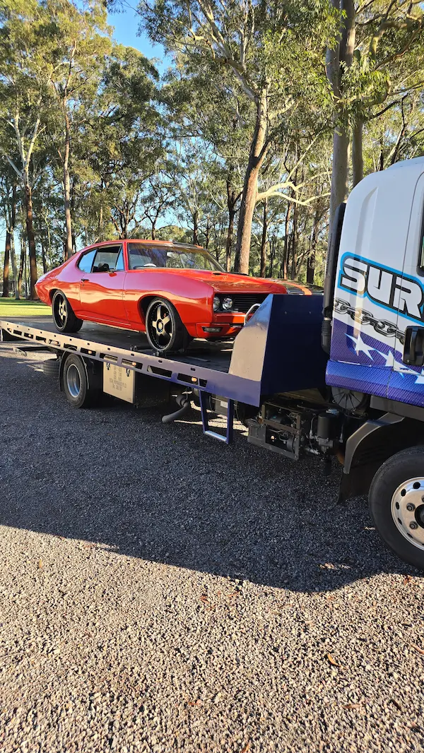 mussle car on tow truck tilt tray