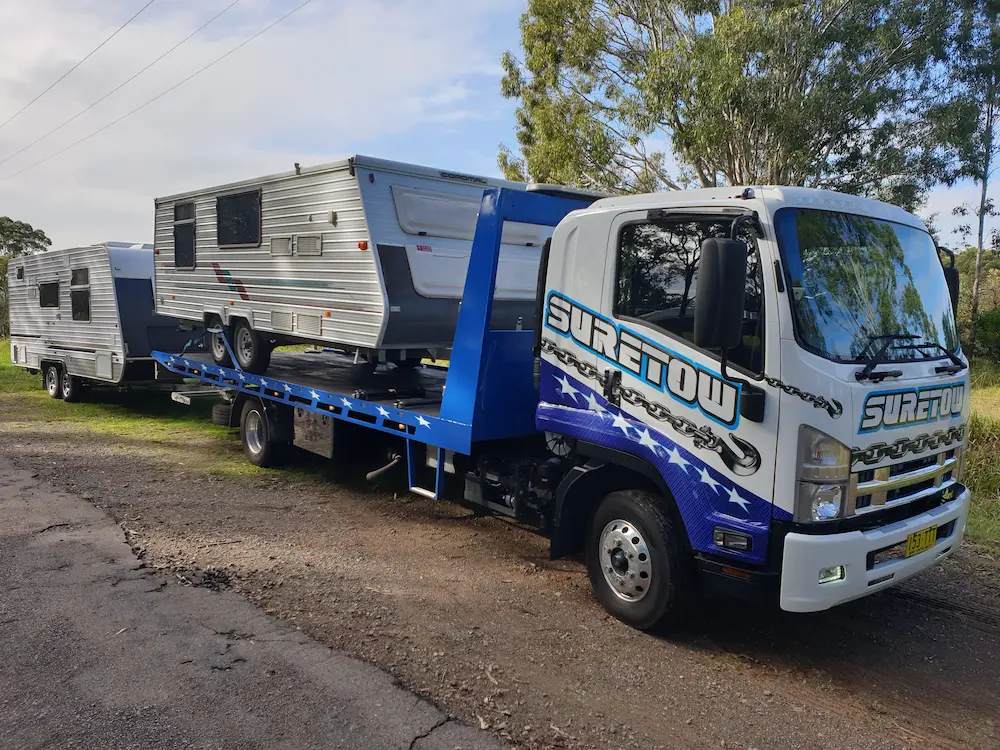 caravans being towed by a tow truck